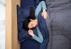 man in blue shirt sleeping